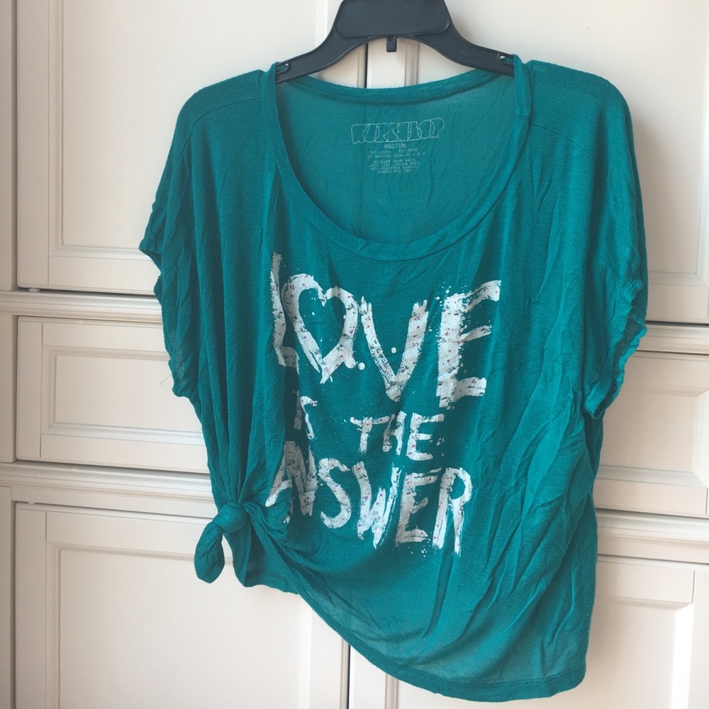 Teal graphic tee with writing